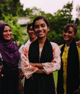 a group of girls smiling