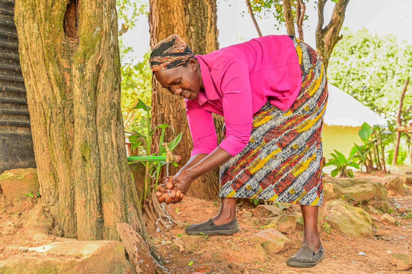 World Vision supported Irene with a water tank that she uses to harvest rainwater and irrigate her fruit trees that include mangoes, lemons and pixies. ©World Vision Photo/ Hellen Owuor