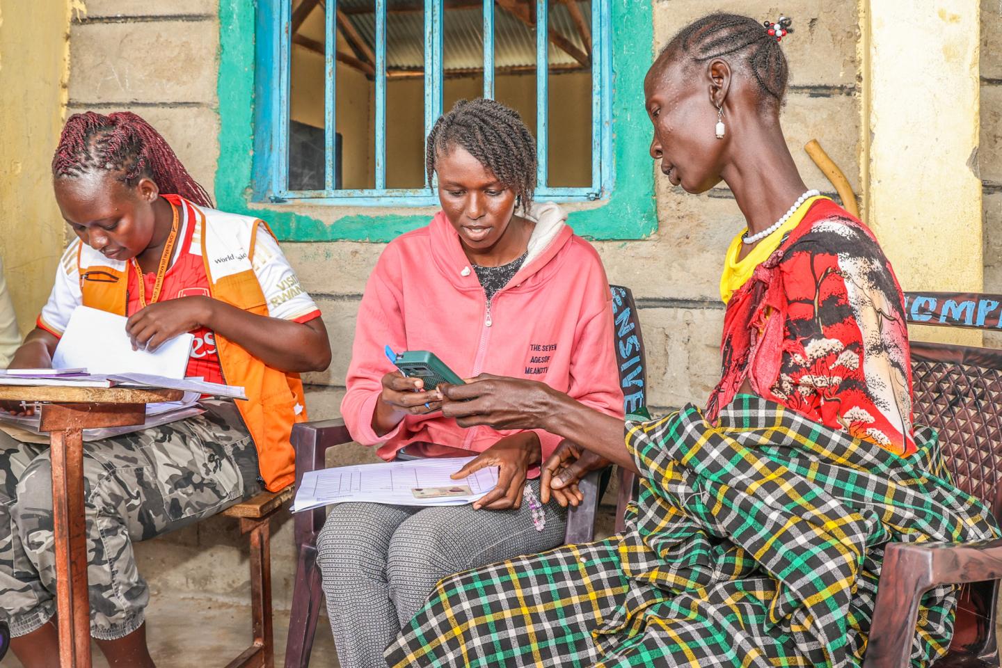 Field enumerators verify Lokolita’s details during the household validation exercise in Turkana Central, part of the process to ensure drought-affected families receive cash assistance support. ©World Vision Photo/Mirriam Kioko