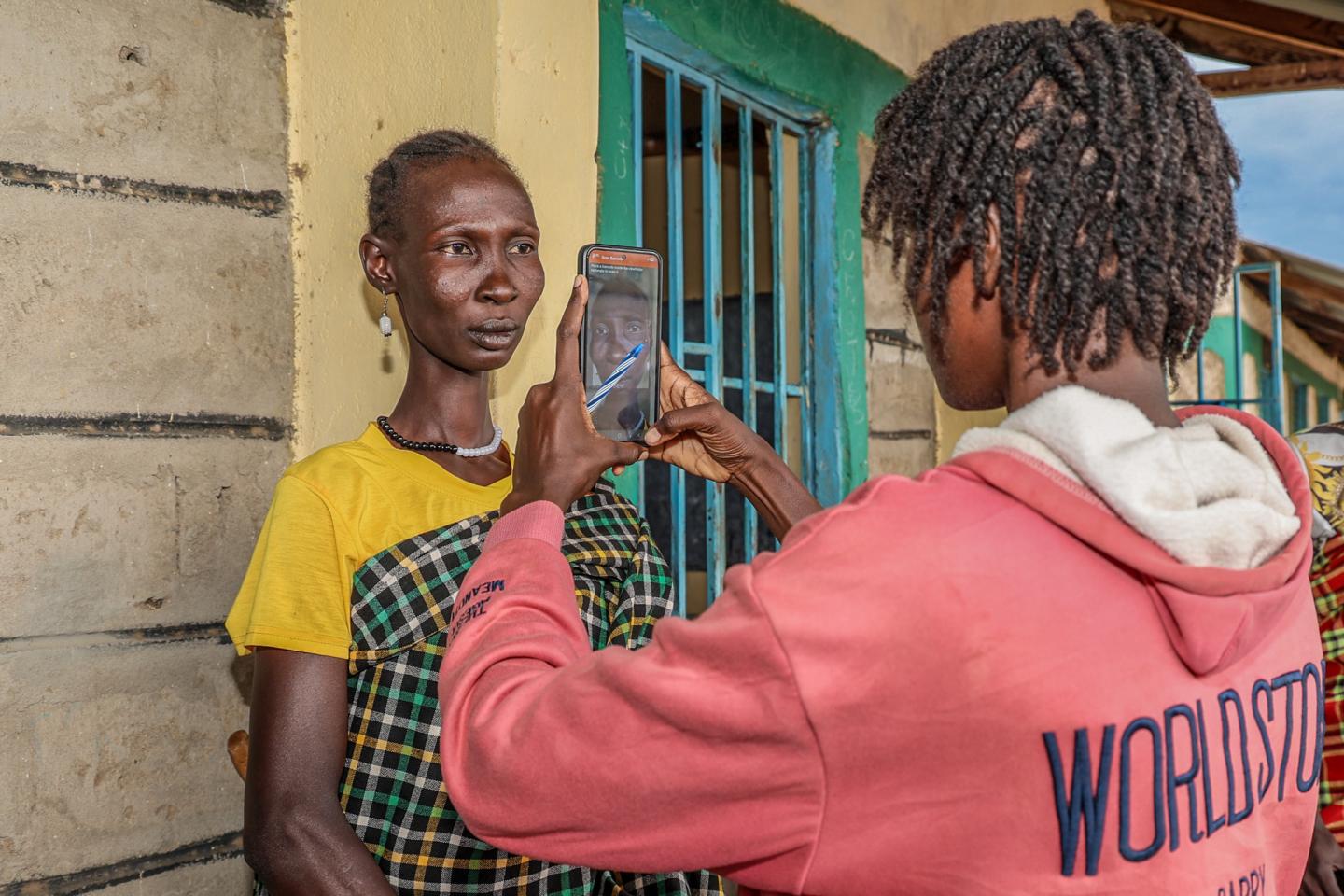 The validation process includes photo verification to help ensure cash assistance reaches vulnerable drought-affected households in Turkana. ©World Vision Photo/Mirriam Kioko 