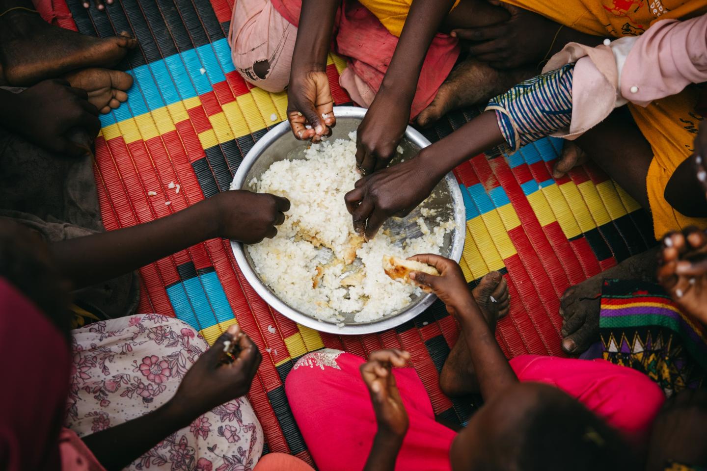 Children play, learn, and share a free meal at the El Neiem Multi-Purpose Community Centre in El Dain, Eastern Darfur
