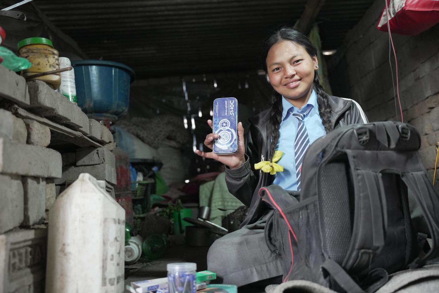 Asta shows school supplies supported by CDS and WVI Nepal. (© 2026 World Vision International Nepal/Deepshikha Shrestha)