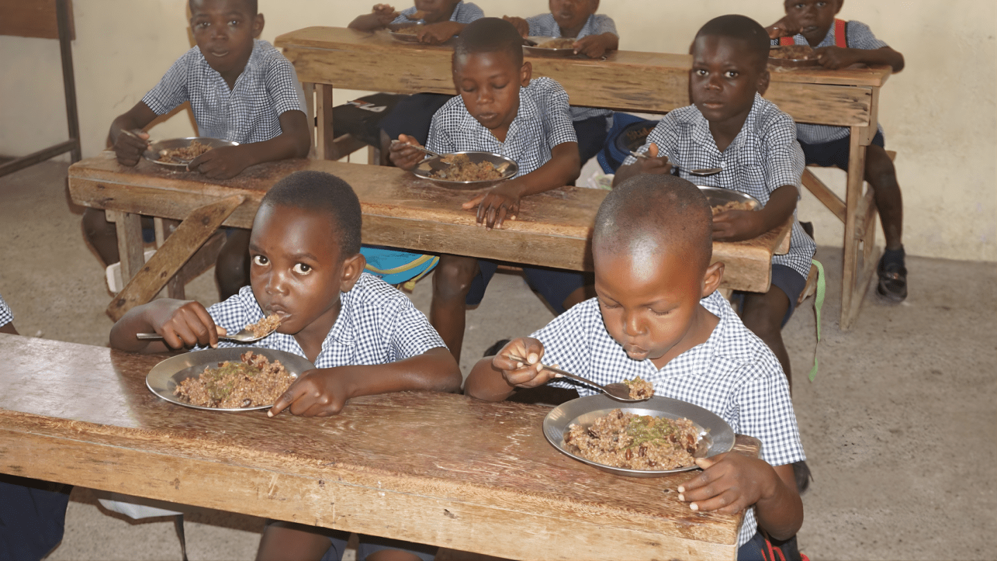 Students share a nutritious school meal at the National School of Grand Pré, Morne Pelée — Haiti, 2025.