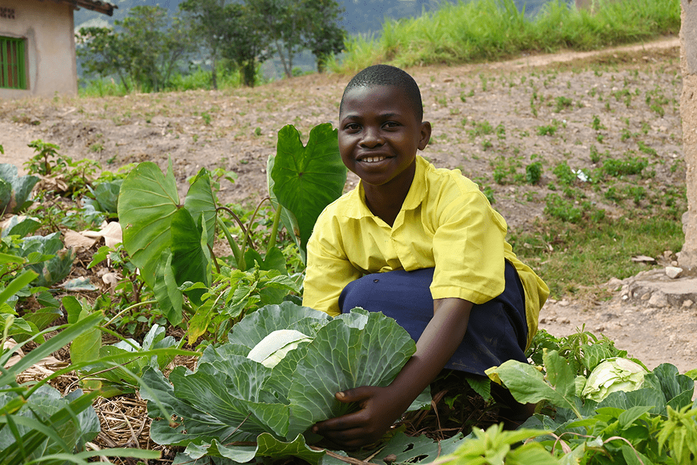 12-year-old Marie Irene in her Kitchen garden