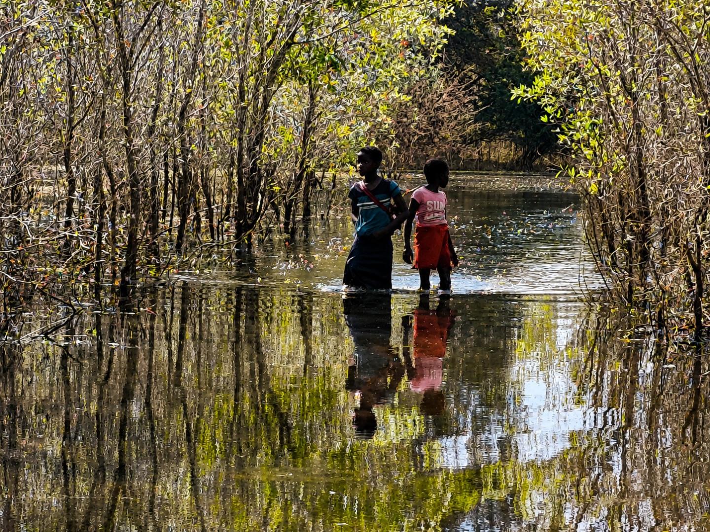 Children Still Walking Through Water to Reach School 