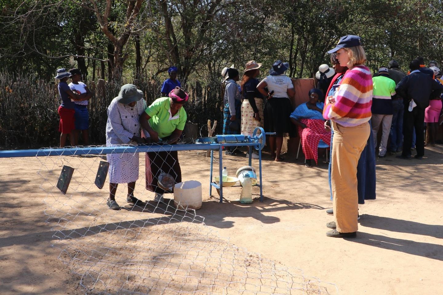 Some of the project participants making a mash-wire fence 