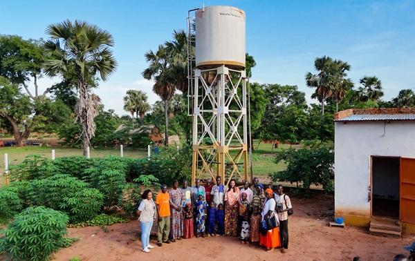 The regional director with members of the Korkoin Water Management Committee