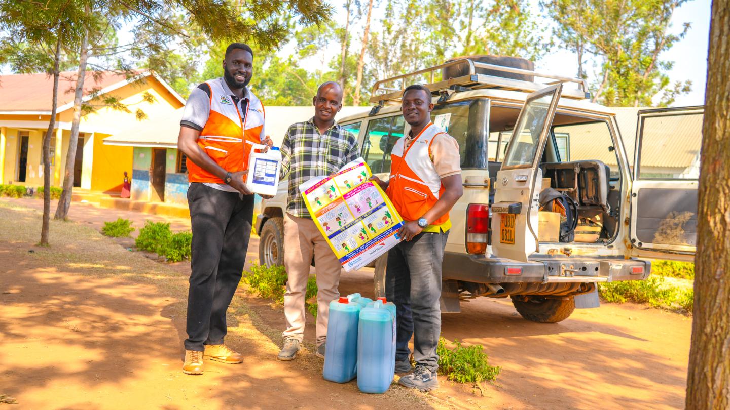 World Vision Team distribution Ebola Infection Prevention and Control supplies to Rugarama primary school