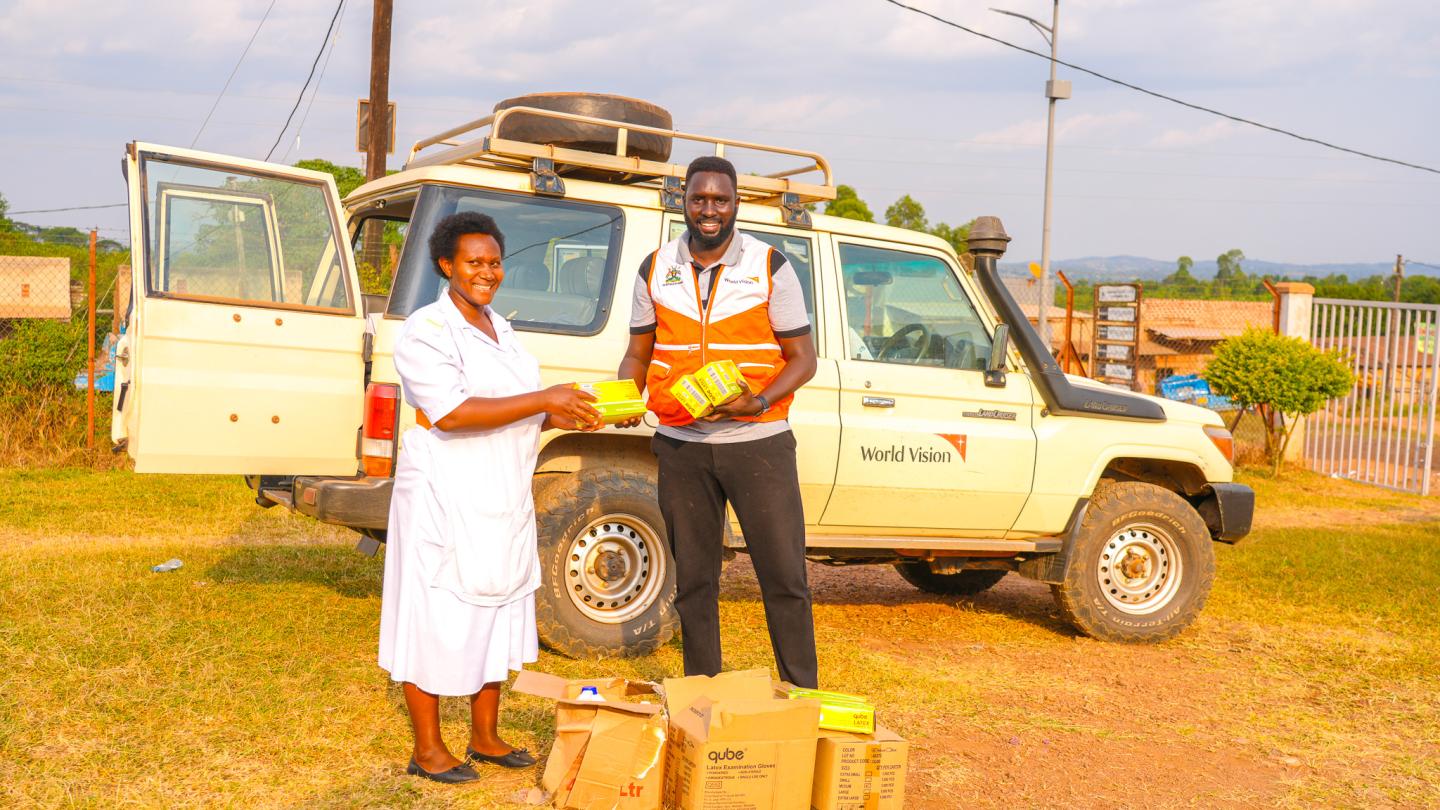 World Vision team distribute Personal Protective Equipments to Kabambiro Health Centre III. © World Vision Photo/Mungu Jakisa Brian