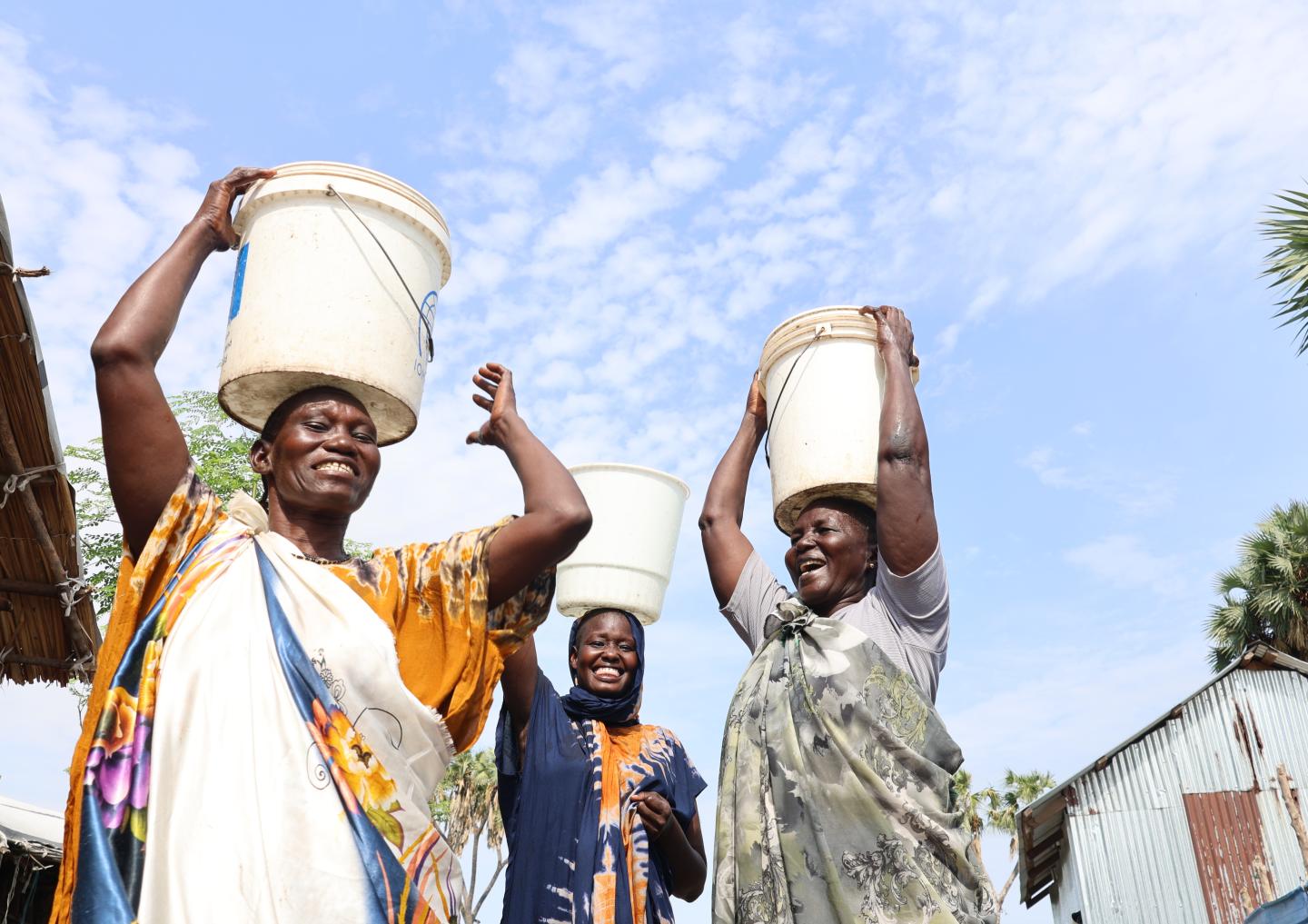 Nyabon and women walking home 