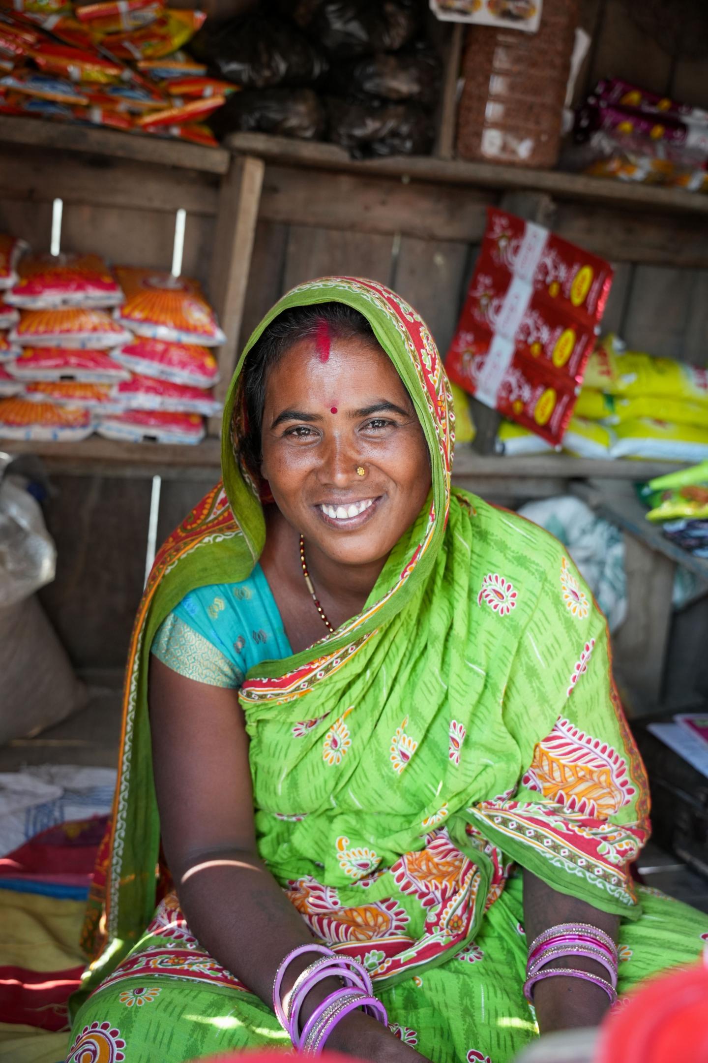 Tara Devi sits at her shop 