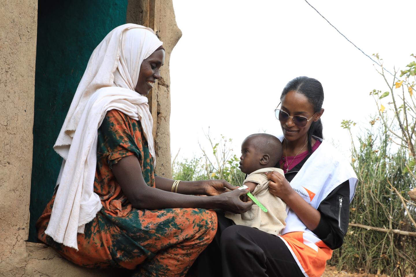 Kamila screening her child after training
