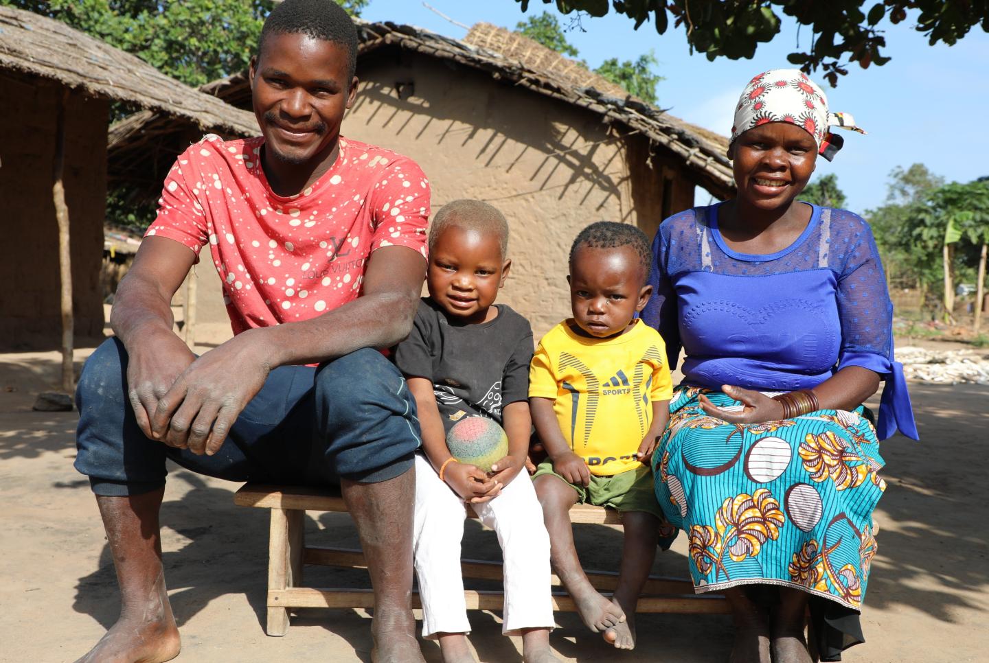 Trangelito with his family outside their home in Itoculo