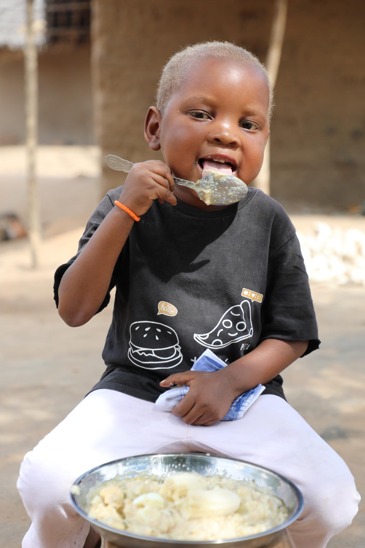 Trangelito eats enriched porridge