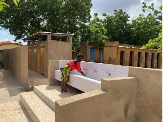 A little girl washing her hands in Burkina Faso