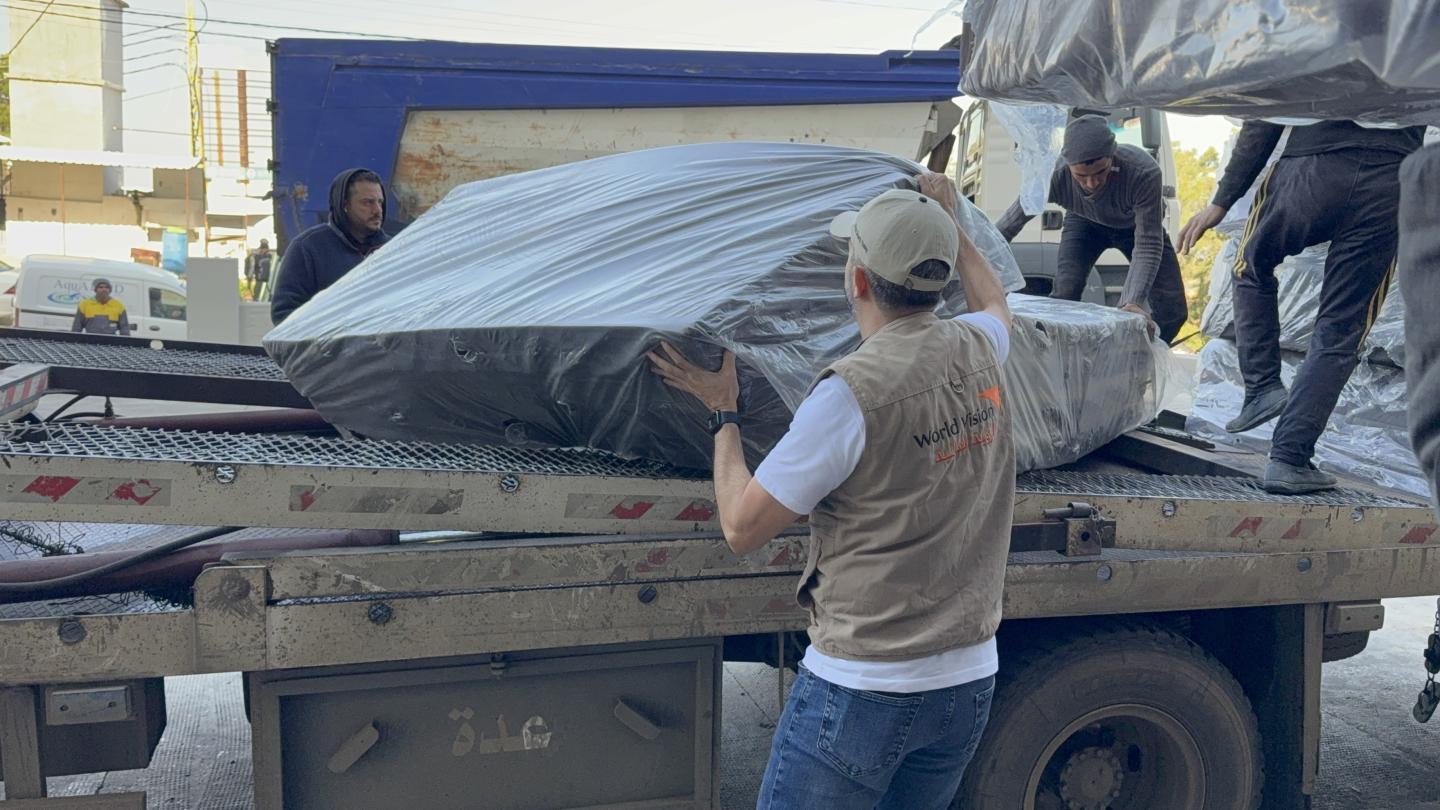 WVL staff putting matresses for distibution