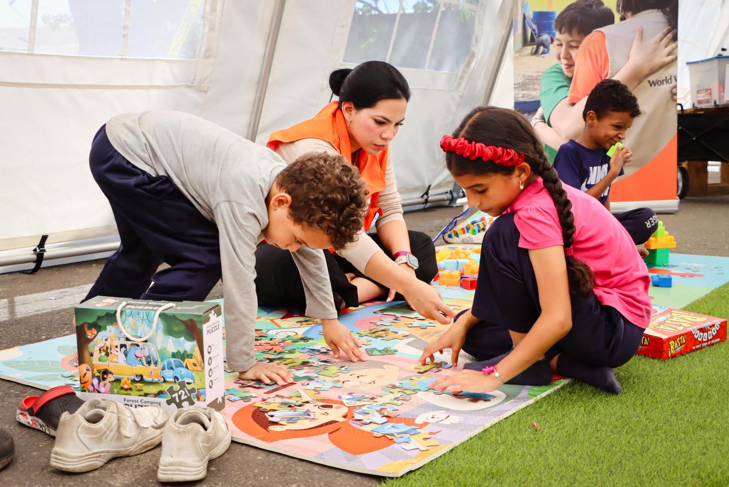 Children take part in a psychosocial support activity at a World Vision child-friendly space as humanitarian efforts move from emergency rescue to early recovery.