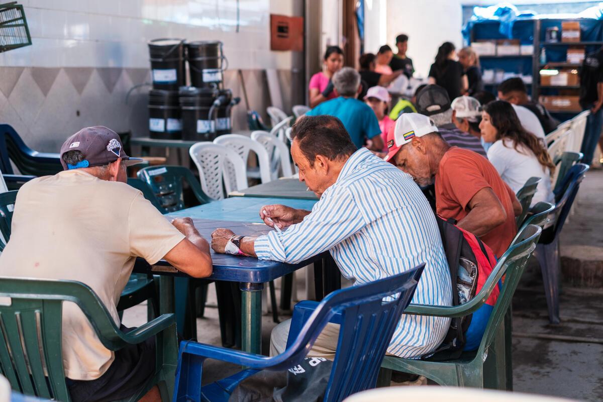People at the centre eating and enjoying their meals