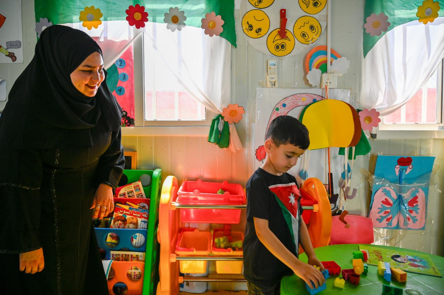 Asmaa, with her son, Rayan, five years old, in one of classes. 