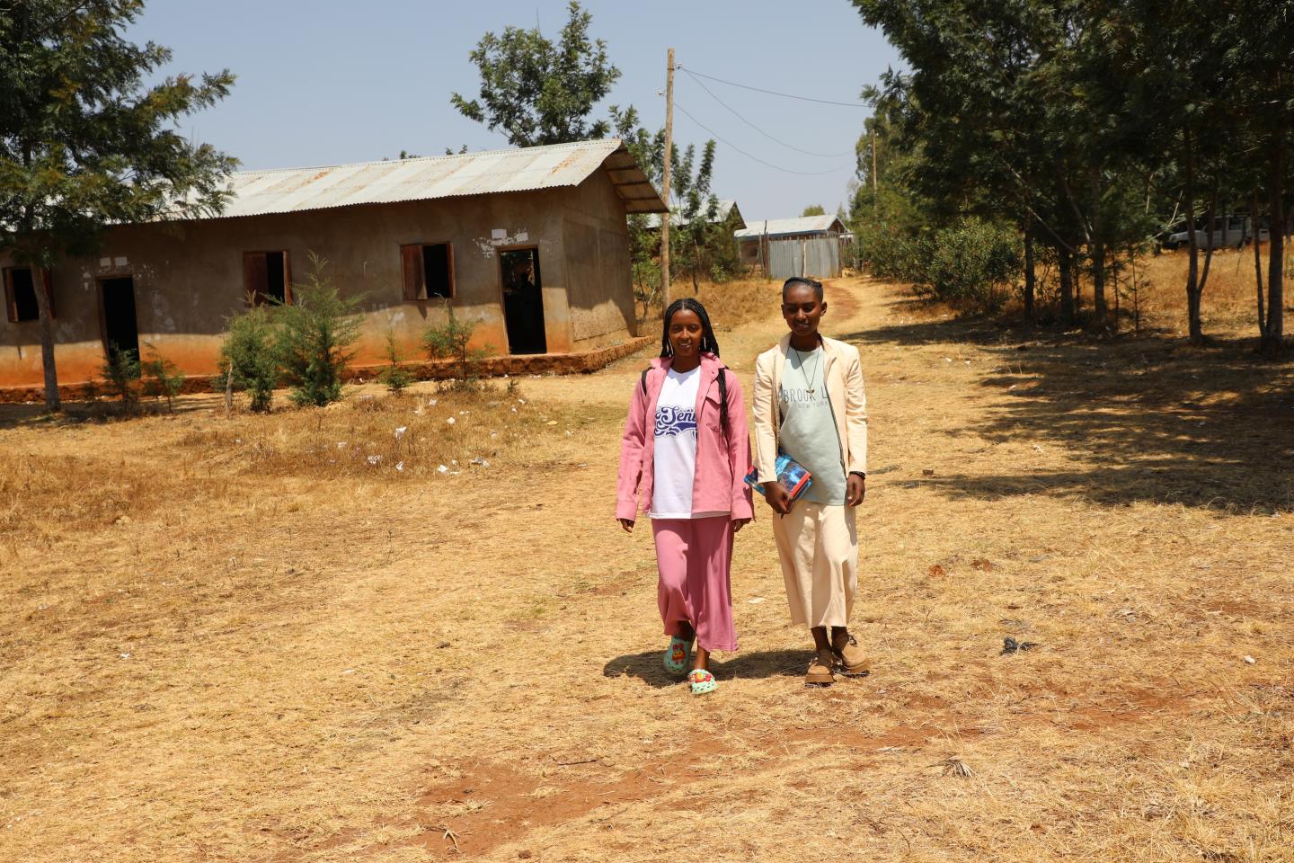 Yadani at school, walking with a friend