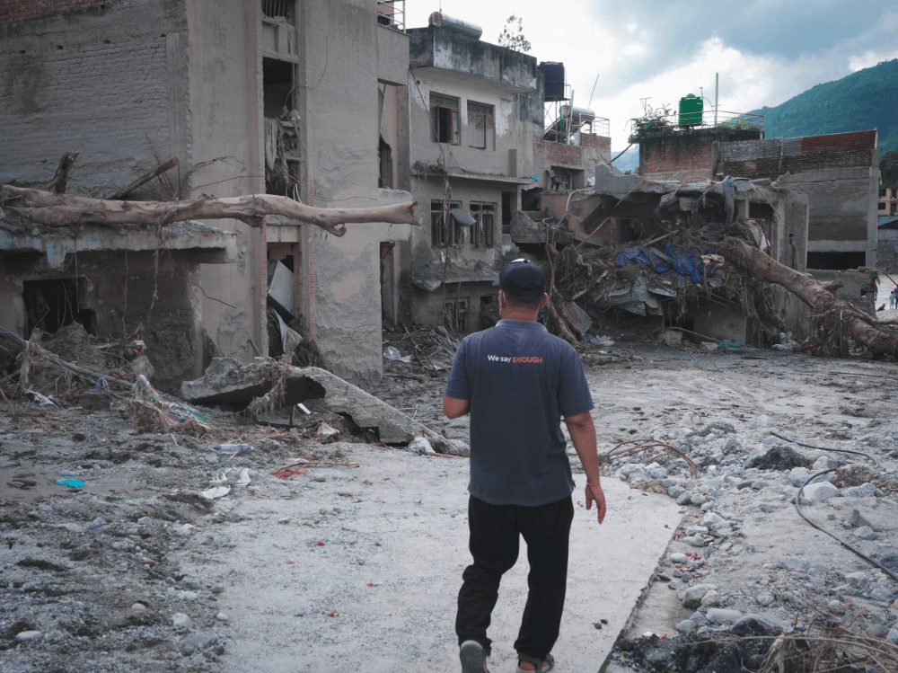 Jiban walks through his community