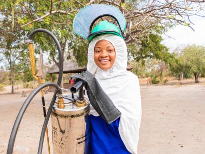 18-year-old Anne who is spraying homes in Malawi