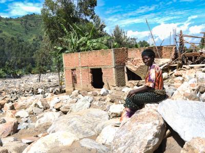 Furaha is a survivor of the floods in Kalehe. She is sitting where her house was built before the floods and landslides