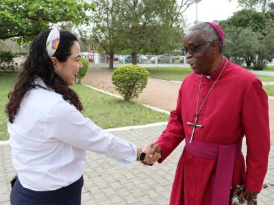 Moment when the bishop arrives for an event where his contribution to child well being in Mozambique is celebratd