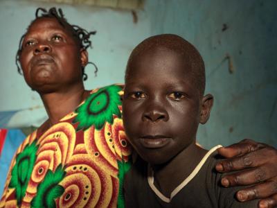 Madela, 8, with his mother Semira at home in Juba, South Sudan.