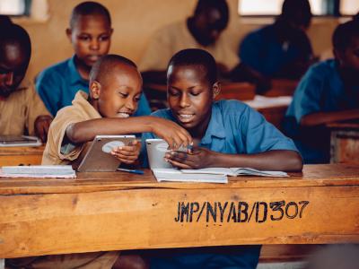 Students at Nyabicwamba Groupe Scholaire with tablets provided by World Vision
