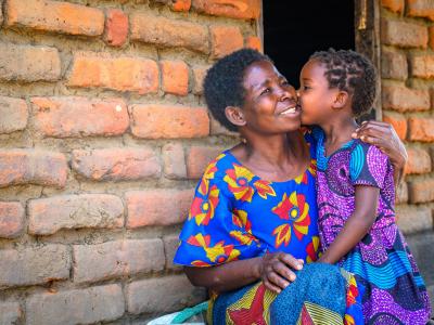 child kissing mother