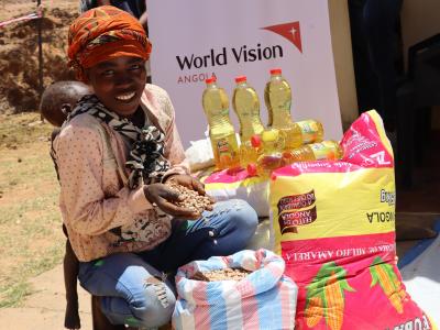 Beneficiary of the project receiving the basic food basket