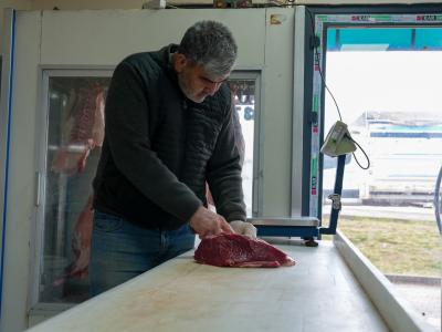 Ali, hard at work in his shop, shared how deeply connected he is to his craft—having inherited the butchery business from his father, who was also a butcher. A legacy of passion and perseverance lives on. — World Vision Syria Response, Samer Asaid
