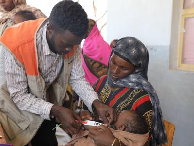 Bira getting her son checked