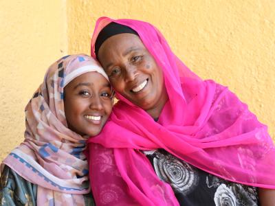 Jemanesh and her daughter smiling