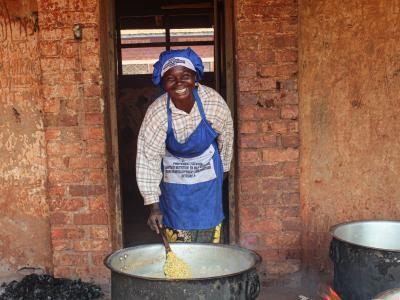 Jina cooking for pupils at Kakombo primary school