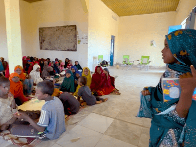 A girl standing in front of her class