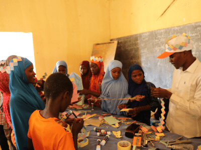 Children and their trainer in action during training.