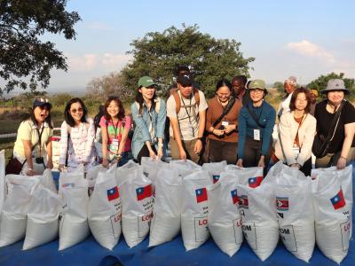 Taiwanese with bags of rice donated to vulnerable families in Eswatini