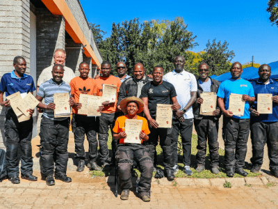 Rose (sitting) with her training counterparts and trainers from the Global Fleet after receiving their certificates
