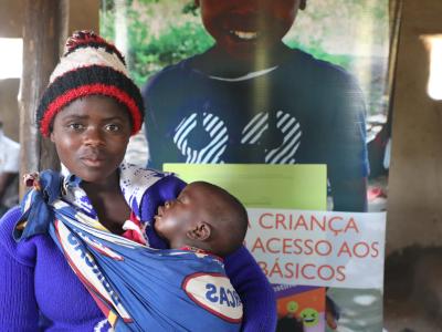 World Vision promoted an event to bring legal services closer to community. The lady in the picture registered a child saving time and resources.