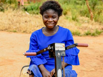 Gloire in her wheelchair received from World Vision