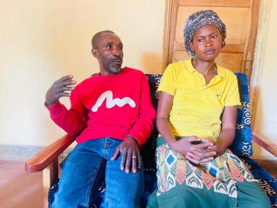 Joseph and his wife in their living room