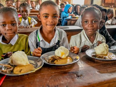 Children enjoy their meal during the Launch of the Supplementary School Meal Program in  Tanganyika Province DRC