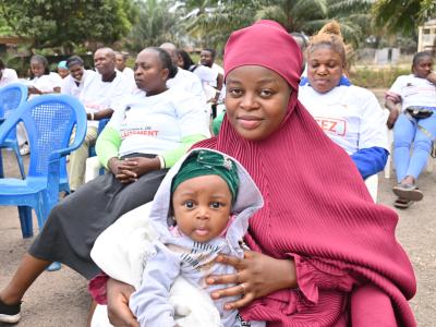 Saidate holding her child at a breastfeeding training session