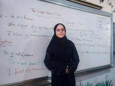 Lina* in her class with her new glasses, World Vision Syria Response