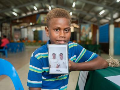 Francis with photo of his sponsors 