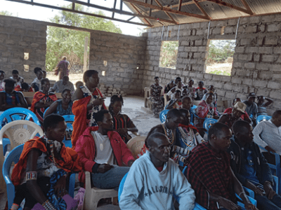 A woman contributing during CVA engagement session in Ngurumani