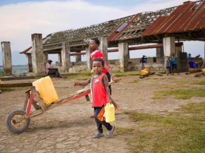 A child coming from fetching water