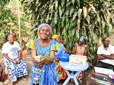 A member of a saving group showing her money